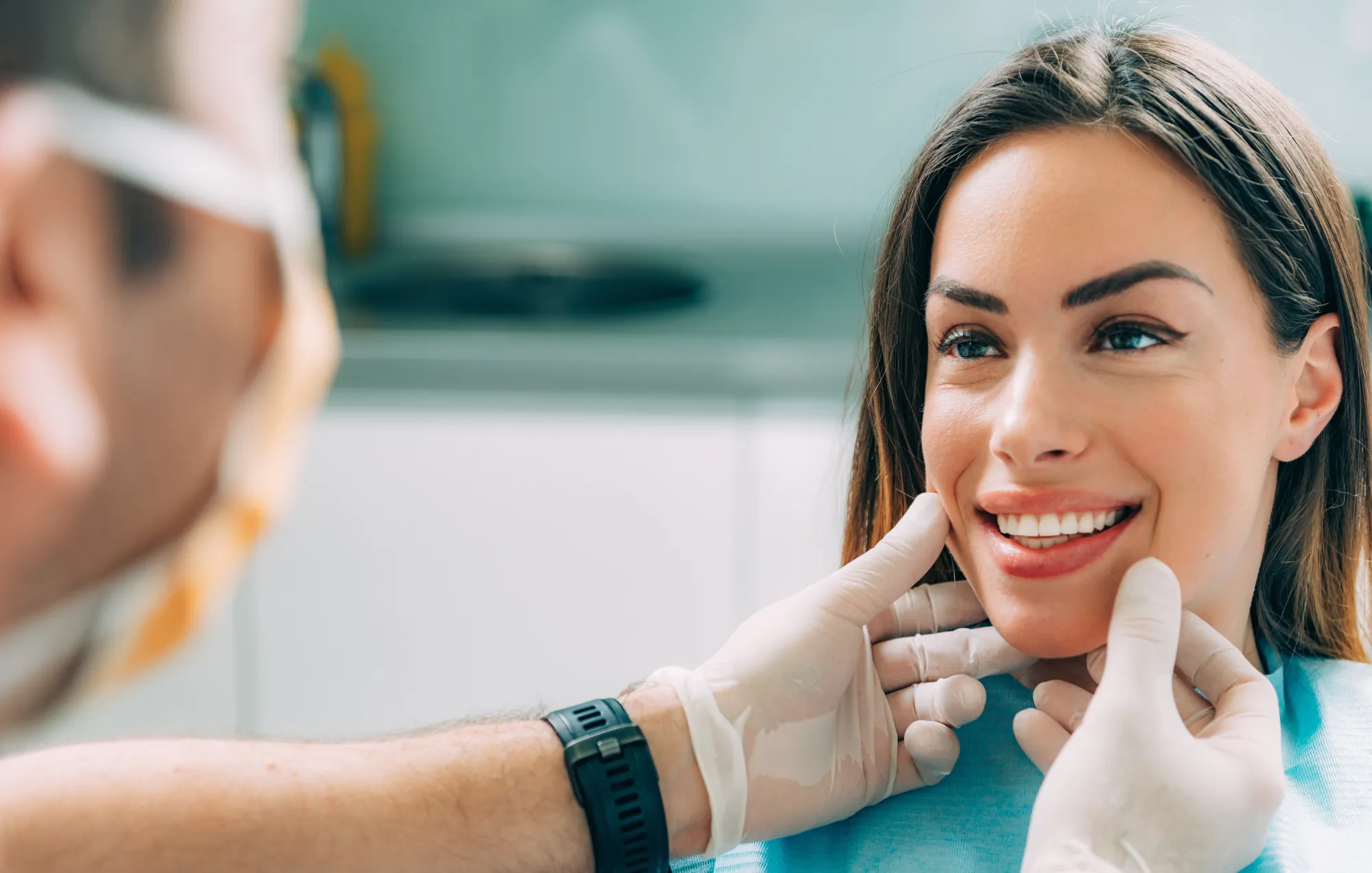 A woman undergoing a cosmetic dentistry consultation