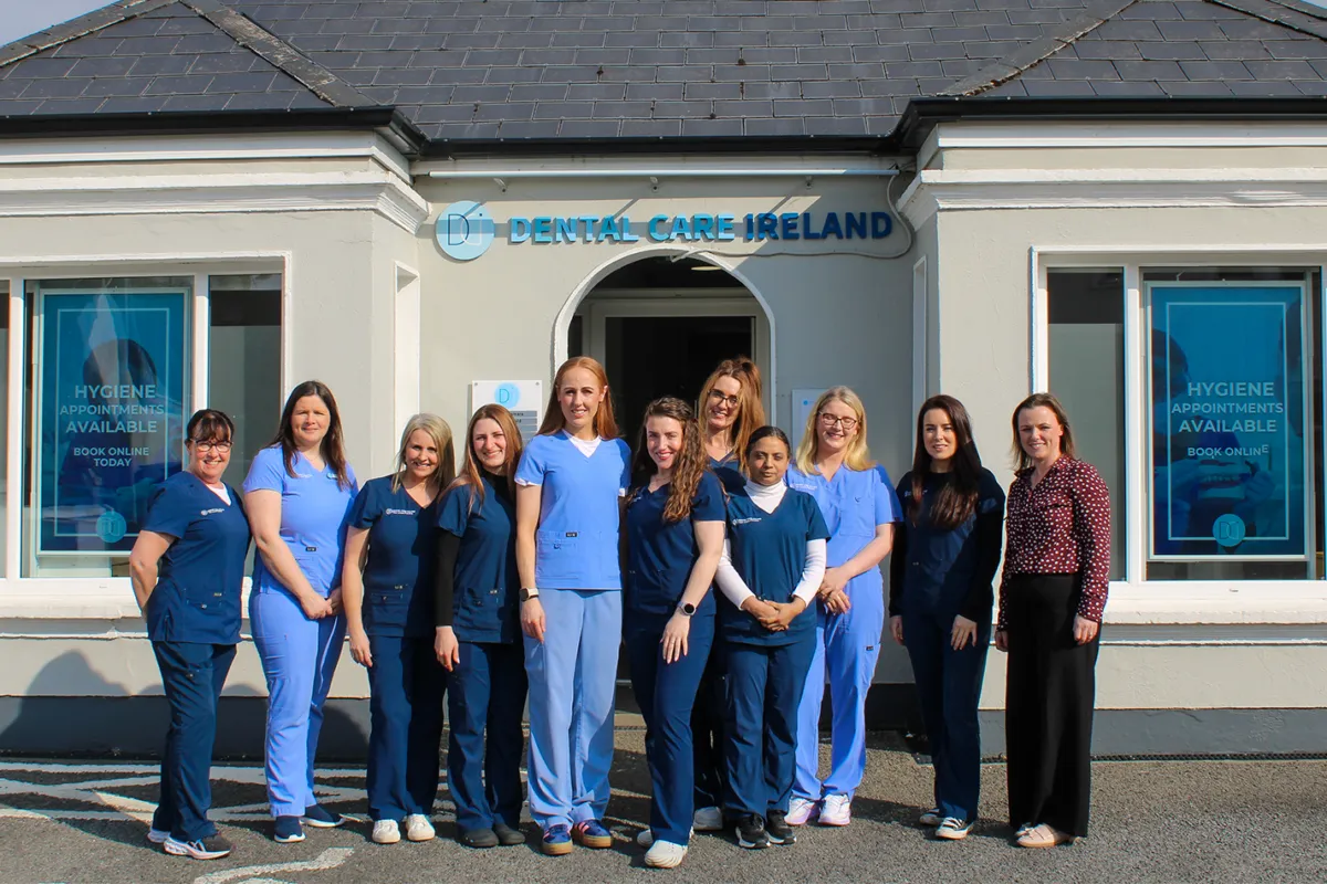 A group photo of the Castlebar Dental team outside the practice.