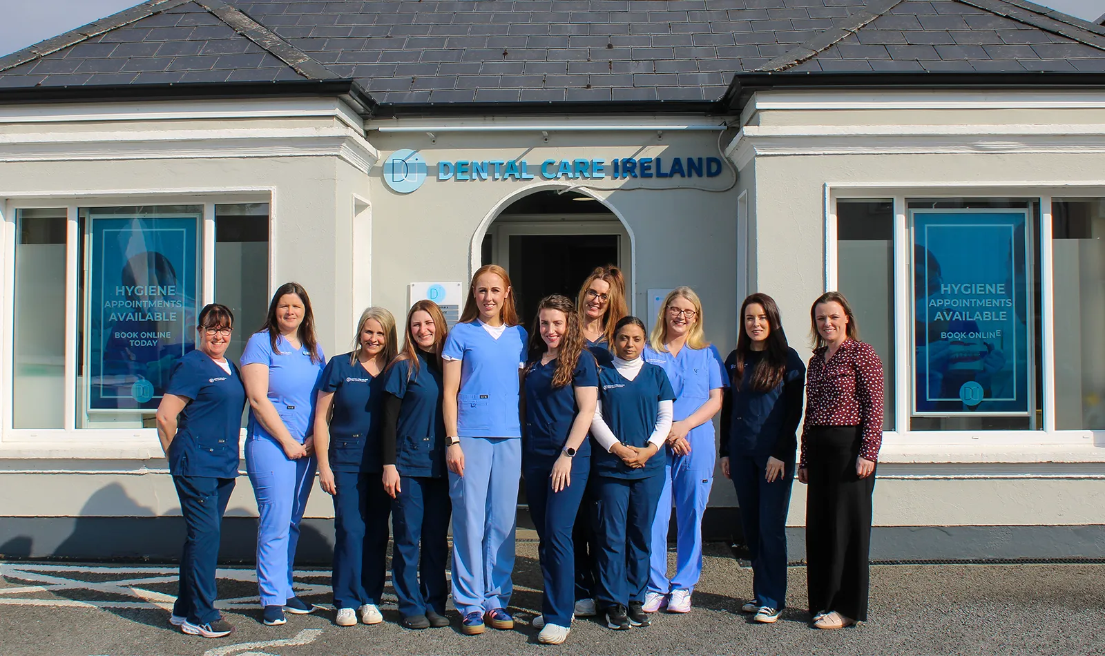 A group photo of the Castlebar Dental team outside the practice.