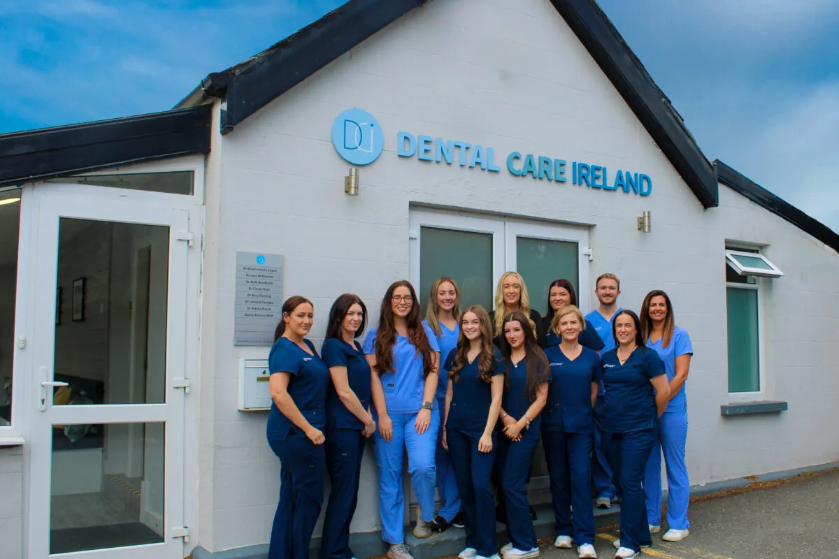 A group photo of the Dental Care Ireland Greystones team outside the practice.