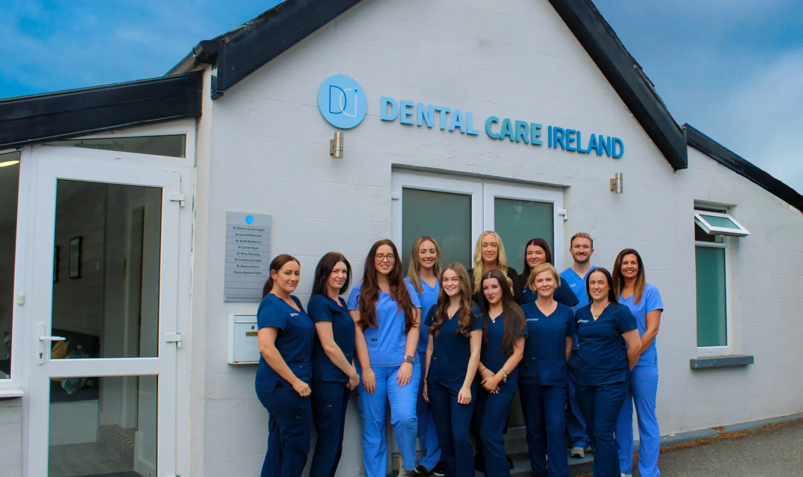 A group photo of the Dental Care Ireland Greystones team outside the practice.