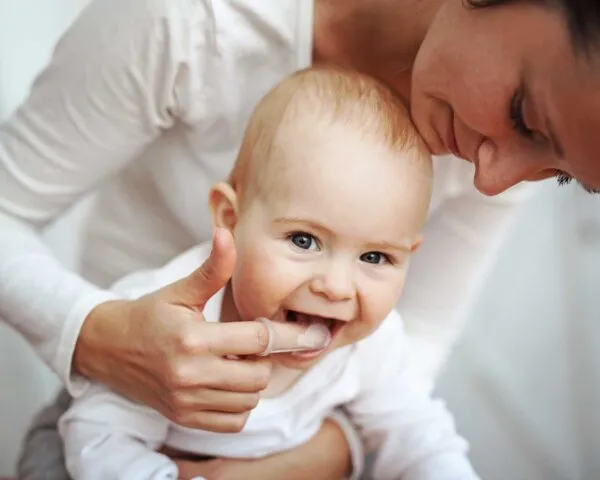 Introduce your baby to the idea of brushing as soon as their first tooth appears.