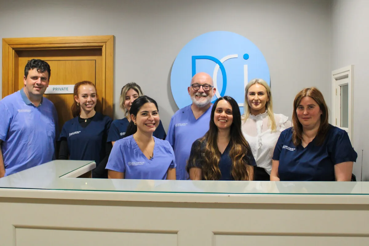 A group photo of the Limerick Dental team at the reception desk.