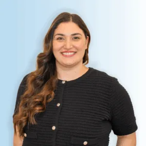 A professional headshot of Deni Sincraian
